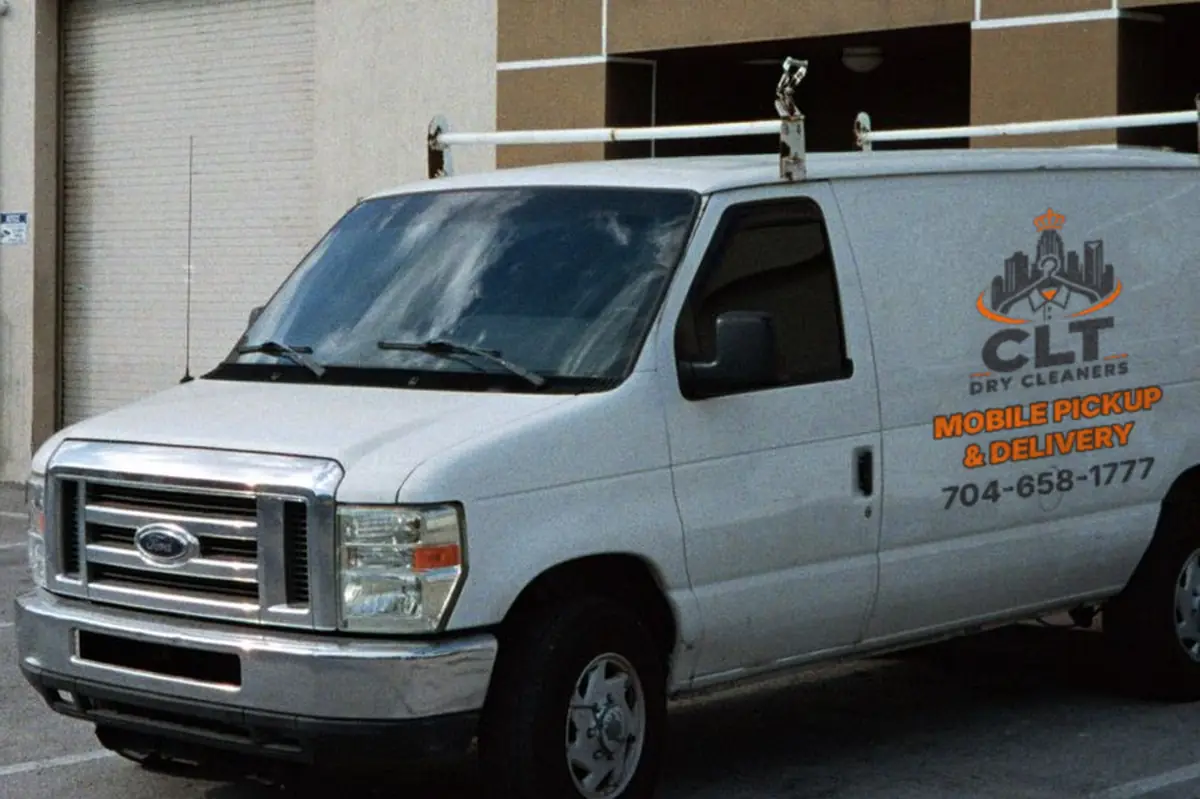 Dry Clean Spot pickup and delivery van with the CLT Dry Cleaners logo